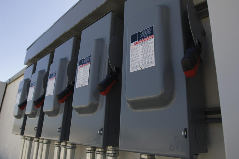 Closeup of electrical breaker boxes at solar power plant