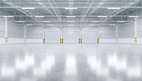 factory warehouse with roller doors and overhead lighting