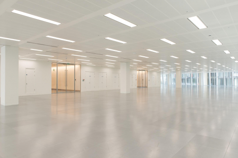 Empty office building interior with electric lighting