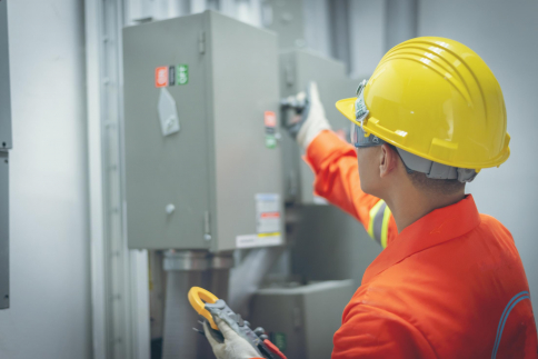 close up men working with the control cabinet