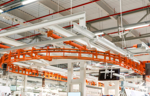 Conveyor for parts in an industrial building