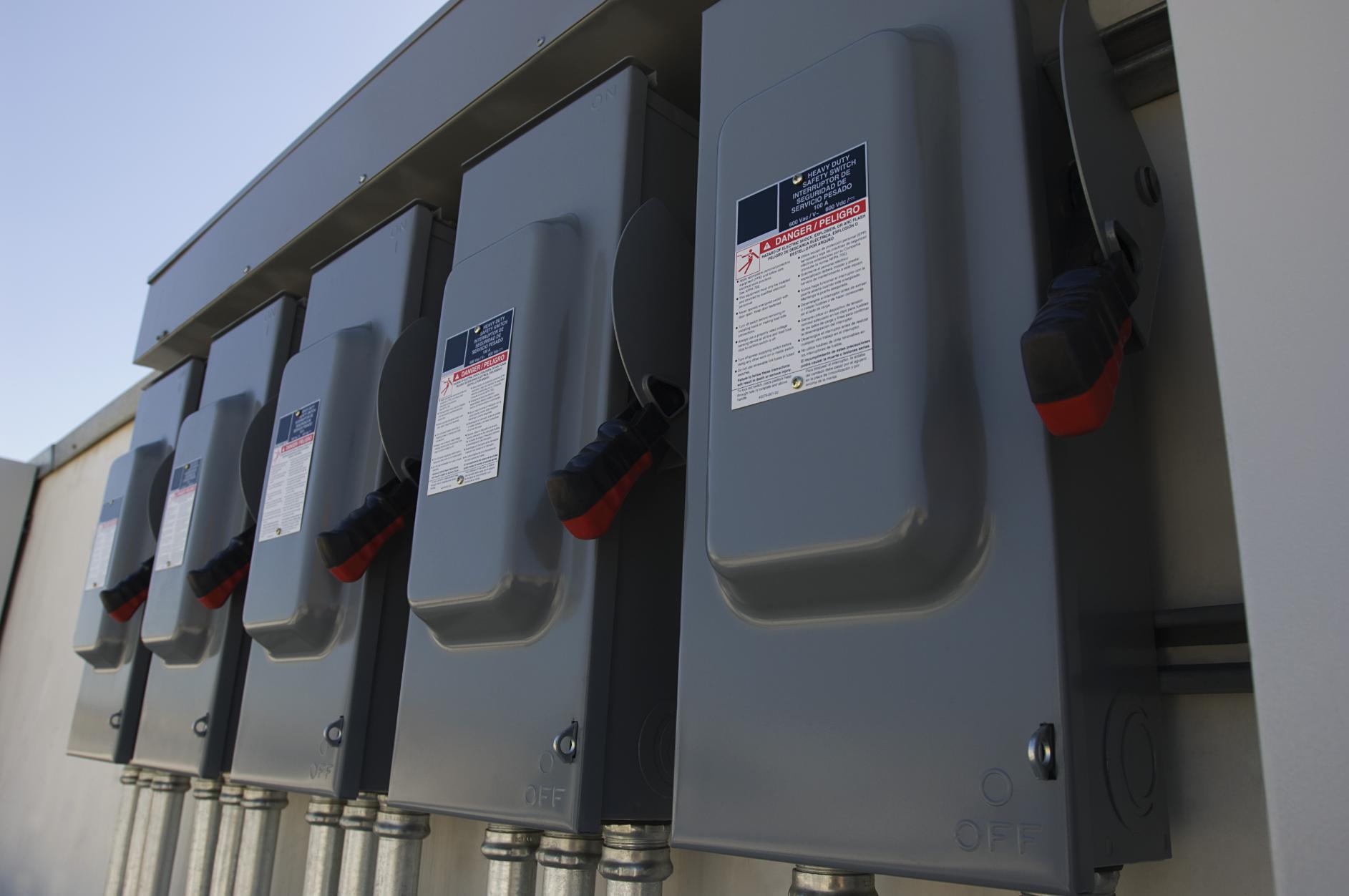 Closeup of electrical breaker boxes at solar power plant