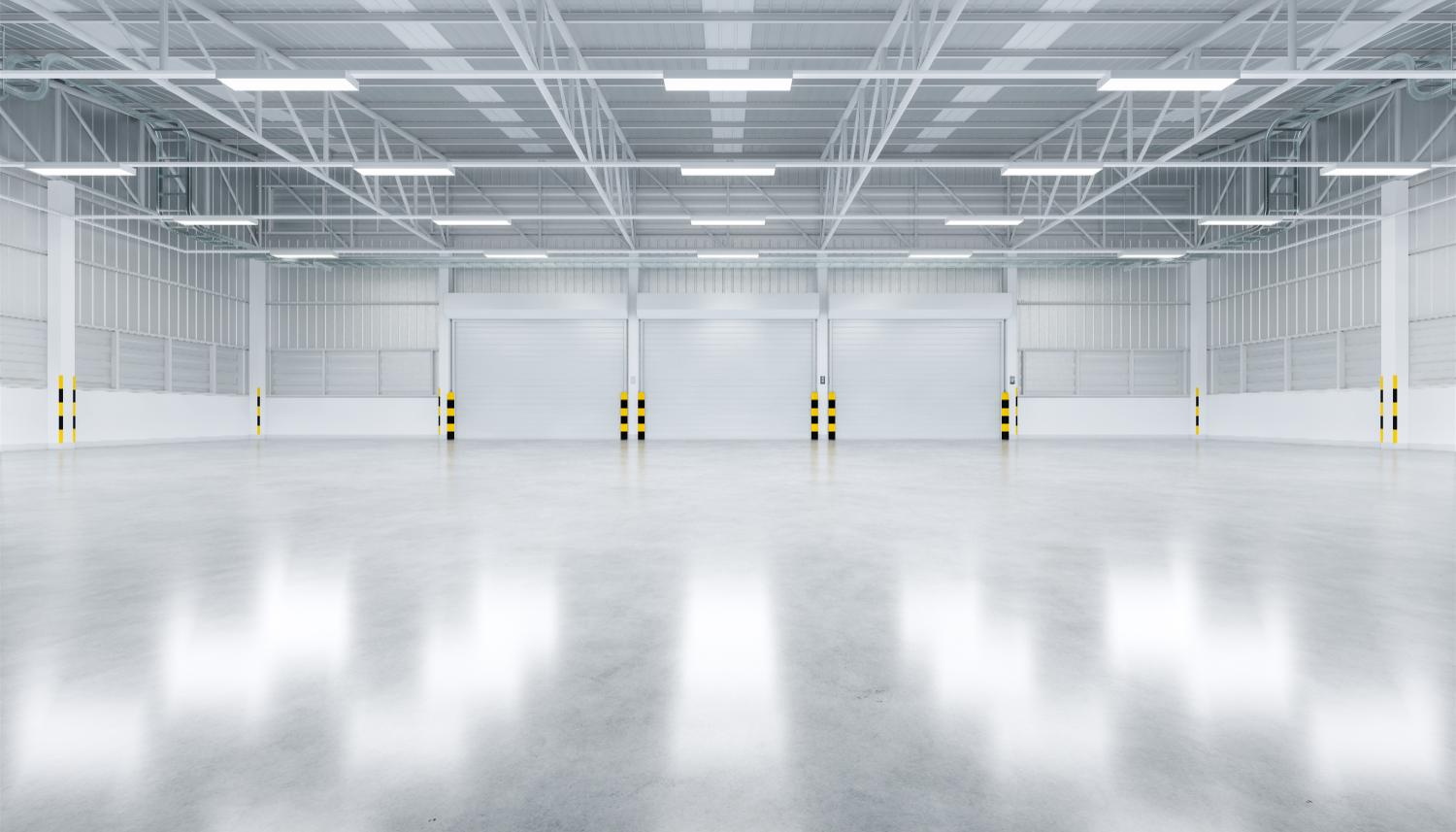 factory warehouse with roller doors and overhead lighting